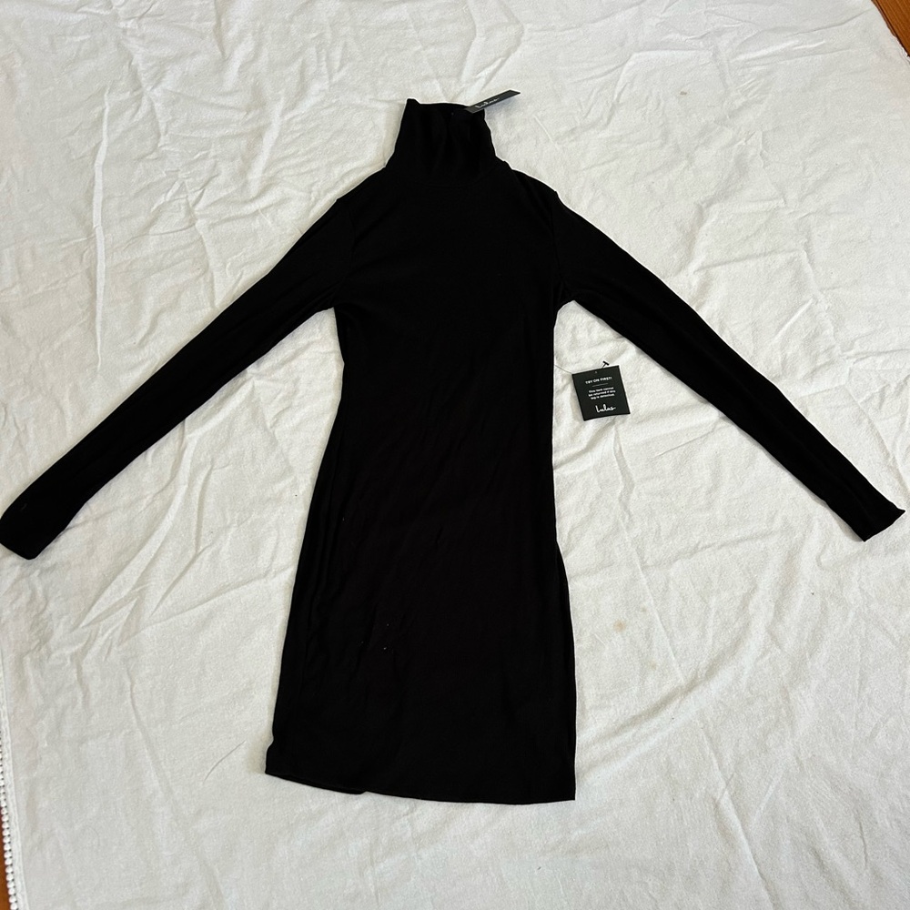 Lulu’s turtleneck body con ribbed dress. M.